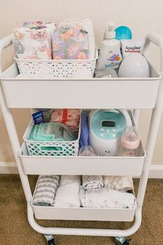 a white cart filled with lots of diapers