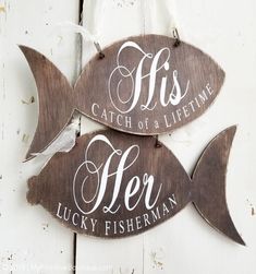 two wooden signs that say fish, catch of a life time and be lucky fisherman