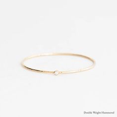 The Delicate Diamond Yellow Gold – Yearly Company Minimalist Diamond Round Bangle, Minimalist Round Diamond Bangle, Minimalist Gold Bangle With Diamond Accents, Minimalist Everyday Diamond Bangle, 14k Gold Wedding Bangle With Single Diamond, Fine Jewelry Bangle With Single Diamond For Anniversary, Minimalist White Gold Bangle With Single Cut Diamonds, Minimalist White Gold Diamond Bangle, Minimalist Single Cut Diamond Bangle