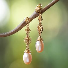 Bali sings a serenade of grandeur through these 18k gold-plated earrings, crafted by artisan Zayd Makarim. Classic trends inspire these dangle earrings, whose details mimic the region's royal ornaments. Peach cultured pearls add the final touch, evoking the island's dawn. Folk Art Jewelry, Pearl Dangle Earrings, Art Earrings, Mens Jewelry Necklace, Birthstone Earring, Final Touch, Pearl Earrings Dangle, Gold Earrings Dangle, Gold Plated Earrings