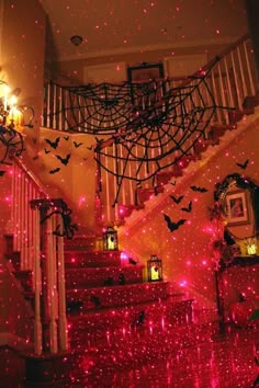 the stairs are decorated with bats and lights for halloween night, while the ceiling is covered in stars