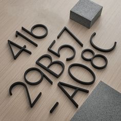 Love ❤️ Decors - Black Floating House Numbers Our black house numbers are easy to install and bring a modern touch to your home. They are made with with high-quality zinc alloy material with a smooth gloss black coating. They stand out beautifully due to their striking black finish, sure to grab anyone's attention. We wanted our house numbers to be a focal piece for anyone walking by, we created four different house numbers so you have a choice of which colour. They come in a black, gold, White Suspended House, Black House Numbers, Modern Black House, New Homeowner Gift, Door Numbers, House Doors, Wall Plug, Address Sign, Knobs And Handles