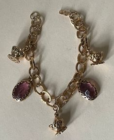 "Etched chain charm bracelet. 2 Purple  Rhinestone charms and 3 charms champagne bottle in ice bucket  Very good to excellent condition  approximately - 7.5\" with clasp, charms approximately - 1\"  04/14/23 1143" Vintage Formal Charm Bracelet, Party Charm Bracelet With Dangle Charms, Party Dangle Charm Bracelet, Chain Charm Bracelet, Purple Rhinestone, Champagne Bottle, Ice Bucket, Charm Bracelets, Etching