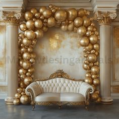 a couch sitting in front of a golden balloon arch with gold balls hanging from it