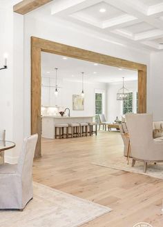 a living room filled with furniture and white walls