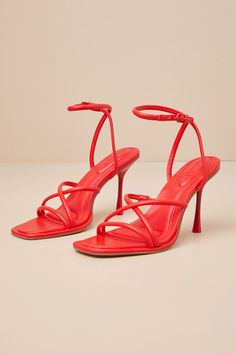 The fiercest of 'fits aren't complete without the D'Amelio Footwear Dalilah Coral Red Ankle Strap High Heel Sandals! Smooth faux leather shapes these standout heels with a square footbed, a strappy crisscrossing vamp, and an open-toe design. Slender straps sprout from the sides that wrap and secure around the ankle with a matching coral red buckle. A sexy stiletto heel finishes the look! 4" stiletto heel. Cushioned insole. Rubber sole has nonskid markings. Man made materials. Imported. Lulus | D Red Heels With Sculpted Heel And Single Toe Strap, Chic Red Strap Sandals, Chic Red Strap Heels, Bold Sandals With Heel And Ankle Strap, Fitted Red Sandals With Heel Strap, Red Heels With Wrapped Heel And Single Toe Strap, Fitted Ankle Strap Sandals With Red Sole, Red Ankle Strap Sandals, Bold Red Sandals For Summer