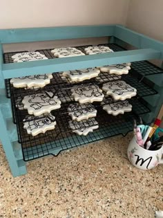 some cookies are cooling on a rack in the kitchen