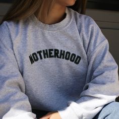 Here for all the sweater weather! I designed this Motherhood sweatshirt for all you mamas and the community we build as we become mothers. I couldn't forget about the dads so I made a matching fatherhood one too. For an oversized look please size up. Sweatshirt is a heather sport gray with forest green font. Heavy blend fleece crew sweatshirt is the perfect mix of 8 oz 50% cotton and 50% polyester. Made using professional heat transfer vinyl that is adhered to the shirt using a professional grad Comfortable Cotton Sweatshirt With Letter Print, Comfortable Cotton Sweater With Letter Print, Cotton Sweatshirt With Lettering, Crew Neck Cotton Hoodie, Casual Crew Neck Sweatshirt For Mother's Day, Cotton Sweatshirt With Lettering For Everyday, Casual Sweatshirt For Mother's Day Loungewear, Heather Grey Letter Print Sweatshirt For Winter, Everyday Cotton Sweatshirt With Lettering