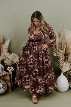 Our Midnight Enchantment Maxi Dress has long whimsical sleeves, stunning multi colored boho designs, lined skirt, and a flirty floucy hem. Style this piece with your favorite accessories and you are going to make an everlasting impression! Neckline: v- neckline with swoop detail Fabric: 97% polyester, 3% Lurex Details: Floucy hem, lined skirt, tiered skirt, boho floral pattern, and long whimsical sleeves 100% Polyester Fit: Oversized; maxi fit Model Specs: Karli is wearing the small in photos. ( Bohemian Brown Tiered Maxi Dress, Flowy Tiered Maxi Dress For Fall, Long Sleeve Boho Dress With Floral Print For Fall, Fall Tiered Maxi Dress With Ruffle Hem, Fall Maxi Dress With Ruffle Hem And Tiered Skirt, Fall Tiered Skirt Maxi Dress With Ruffle Hem, Brown Long Sleeve Boho Dress, Bohemian Ruffle Dresses For Fall, Bohemian Ruffled Dresses For Fall