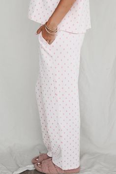 Pink heart pajama pants with elasticated Sunkissed Coconut waistband and side pockets Material is Polyester Tumble dry low Model is 5'6 wearing a small SHOP THE LOOK Small Medium Large X-Large Length 36.5" 37.5" 38.5" 39.5" Waist 13" 14" 15" 16" Sunkissed Coconut, Wedding Guest Romper, Better Everyday, Party Bottoms, Jumpsuit Skirt, Pj Pants, Denim Romper, Shop The Look, Maxi Dress Party