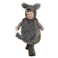 a small child in a costume that looks like a furry animal with horns and tail