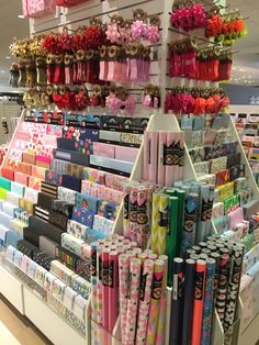 a store display filled with lots of different types of wrappings and gift wrappers