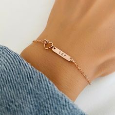 Little Girl Name Bracelet, Rose Gold Heart, Dainty Bar Bracelet, Bridesmaid Bracelet, Christening Gift, Maid of Honor Gift, Wedding Jewelry ♥ Available in silver, gold and rose gold. ♥ Specification: . Bar size 16 x 3.2mm is Sterling Silver or 14K Gold Filled or 14K Rose gold Filled . Heart Charm size 7mm is silver plated or gold plated or rose gold plated . Chain and components are Sterling Silver or 14K Gold Filled or 14K Rose Gold Filled. . Uppercase letter ONLY . Comes in a satin pouch . Length includes charm, jump ring, and clasp. IMPORTANT: Usually jewellery in the pictures looks bigger than in reality. Please consider all given dimension and compare them to the ruler before ordering. All collections of StampedEve: https://www.etsy.com/au/shop/StampedEve?ref=hdr_shop_menu Please read Personalized Bracelets For Bridesmaid Gift On Valentine's Day, Rose Gold Bracelet For Friendship On Valentine's Day, Adjustable Rose Gold Heart Bracelet For Valentine's Day, Personalized Rose Gold Charm Bracelet For Wedding, Adjustable Rose Gold Heart Bracelet For Mother's Day, Valentine's Day Adjustable Rose Gold Charm Bracelet, Rose Gold Heart Charm Bracelet For Friendship, Dainty Bracelets For Bridesmaids, Valentine's Day Gift, Adjustable Rose Gold Heart Bracelet For Wedding