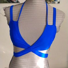 Bright Royal Blue Wrap Around D Tie Bikini Top With Adjustable Straps. Nylon And Spandex With Removable Padding. M Blue Strappy Swimwear For Vacation, Blue Strappy Swimwear For Pool, Blue Stretch Swimwear With Bra Friendly Feature, Blue Stretch Swimwear With Bra Friendly Design, Blue Stretch Swimwear With Bra-friendly Design, Blue Strappy Swimwear For Sunbathing, Blue Strappy Swimwear For Summer, Fitted Blue Swimwear, Bra Friendly, Fitted Bra Friendly Blue Swimwear