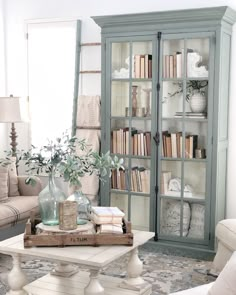 a living room filled with furniture and bookshelves