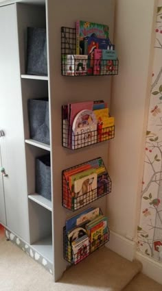 a book shelf filled with books and toys