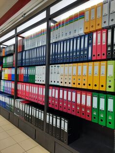 rows of file folders on shelves in a library