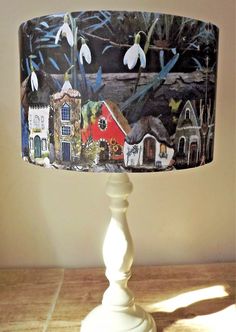 a lamp shade that is on top of a table