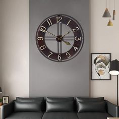 a living room filled with furniture and a large clock on the wall above the couch