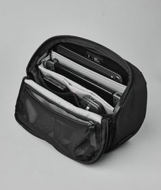 A revolutionary all-in-one solution designed to streamline your daily tech essentials and keep you organized on the go. It’s a triple threat: tech pouch, desk caddy, and sling bag all in one. Functional Black Pouch For Everyday Use, Functional Rectangular Nylon Pouch, Portable Modern Pouch For On-the-go, Peak Design Tech Pouch, Black Case With Removable Pouch For On-the-go, Portable Workstation, Desk Caddy, Tech Pouch, Functional Desk