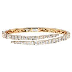 Let your style shine with this fancy and elegant diamond bangle bracelet. Crafted in 18k yellow gold. This stunning bracelet features 74 channel set tapered baguette cut shimmering diamonds with a total weight of 4.27 carats. Diamond color G-H and VS-SI clarity. It's stackable and easy to wear. Bangle width: 4.3mm. Weight: 18.39 grams. Wrist fit: 6.5 inches. Comes with a presentable gift box and appraisal. Diamond Bangles Bracelet Unique, Diamond Bangle Bracelet, Diamond Bangles Bracelet, Baguette Cut Diamond, Diamond Bangle, Channel Set, Baguette Cut, Italian Charm Bracelet, Bangle Bracelet