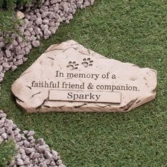 a memorial stone with the words, i'm memory of a faithful friend & companion sparky