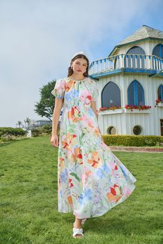 It's easy to fall in love with a look as cute as the Juliet Floral Garden Becca Tiered Maxi Dress! Pastel colorful florals overlay this midi dress with tiers. Short puff sleeves and a round neckline fall in place with an open back. It also has a smocked panel and tie in the back. You can add your white heels to go along this dress! - Puffed short sleeves- Pockets- Tiered- Smocked- Color: White MultiSize + Fit - Model is 5'8" and wearing size XS- Measurements taken from size S - Chest: 17"- Lengt Casual Multicolor Floral Dress For Garden Party, Spring Tiered Floral Dress For Garden Party, Spring Floral Tiered Dress For Garden Party, Spring Garden Party Floral Tiered Dress, Multicolor Tiered Midi Dress For Spring, Tiered Floral Print Maxi Dress For Garden Party, Feminine Multicolor Midi Dress For Garden Party, Tiered Floral Maxi Dress For Garden Party, Feminine Multicolor Maxi Dress For Garden Party