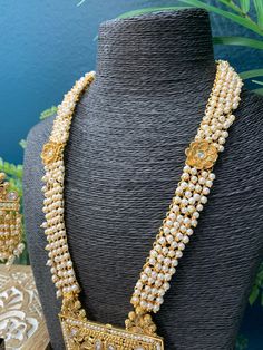 22k gold plated south style necklace / rani haar. Comes with matching earring . Adjustable dori , pearl work all over them mala and clear polki work. earring is about 2.5 inch long, push back . Gold Kundan Pearl Chain Necklace, Gold Chandbali Pearl Necklace For Puja, Gold Kundan Pearl Necklace With Pearl Chain, Bollywood Kundan Pearl Necklace For Puja, Gold Pearl Chain Necklace With Kundan, Gold Kundan Chandbali Necklace With Pearl Chain, Gold Kundan Mala With Latkans, Gold Kundan Necklace With Pearl Chain For Puja, Gold Kundan Mala For Wedding