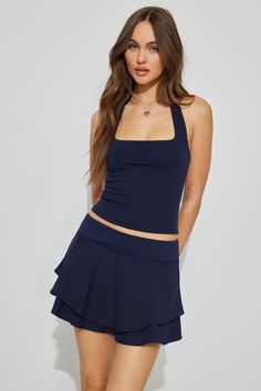 This and a sporty little tank top? Perfection. Features - Slip-on - Tiered hem - Shorts-style lining - Stretchy Size & Fit - Length: Mini - Model is wearing size S Materials & Care - Content: 88% recycled polyester, 12% spandex - Care: Machine wash, cold - Imported Casual Stretch Racerback Tankini, Sleeveless Athleisure Tankini For Yoga, Summer Athleisure Stretch Tankini, Athleisure Sleeveless Tankini For Yoga, Sporty Solid Sleeveless Tankini, Stretch Sleeveless Athleisure Tankini, Casual Sleeveless Tankini For Yoga, Sporty Sleeveless Tankini For Spring, Fitted Tankini For Spring Workout