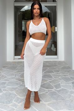 This crotchet maxi skirt is perfect for the summer. Its elasticated waistband provides a comfortable fit, while the soft, breathable material ensures all-day comfort. For the ultimate evening look, pair with the matching crop and black sandals. FABRICATION: 100% polyester SIZING: Crystal's height is 162cm and wears a size AU6/US2 Dress Skirts, Red Swimwear, White Swimwear, Baby Crop Top, Pink Swimwear, Beach Cover Ups, Coverup Skirt, Summer Swim, Long Sleeve Casual Dress