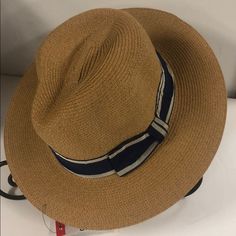 New Never Worn Crushable Panama Straw Hat, Natural Color , Navy Ribbon Trim Casual Blue Straw Hat For Outdoor, Casual Brown Panama Hat For Warm Weather, Casual Adjustable Fedora For Warm Weather, Casual Beige Fedora For Outdoor, Casual Brown Hats For Warm Weather, Casual Brown Hat For Warm Weather, Casual Blue Straw Hat One Size, Casual Beige Fedora For Warm Weather, Casual Adjustable Blue Fedora