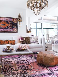 a living room filled with furniture and rugs