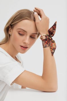 Mini silk scarves and scarf bracelets by Silk Philosophy. Statement accessories suitable for office and everyday wear. Unique gift for her. Multi-functional silk accessory. Wear it as a bracelet, ribbon in your hair, handbag charm or mini scarf or choker; perfect summer accessory #wristscarf #birthdaygift #bracelet #armcandy #ootd #silkscarf #uniquegift #scarfbracelet #bangle #summeraccessories #falloutfits #falloutfitideas #giftideas Mini Scarf, Silk Bracelet, Fifties Fashion, Silk Accessories, Statement Accessories, Scarf For Women, Activewear Fashion, Handbag Charms, Unique Gifts For Her