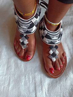 Maasai sandals, gladiators for women ,African beaded gladiators,  women sandals,Summer sandals. This sandals are 100% handmade using maasai beads  All sizes are available as we custom make them.For perfect fitting kindly use the last image as a  guide.Ships via dhl express .Thank you for stopping by. Bohemian Beaded Sandals For Vacation, White Beaded Sandals With Round Toe, Traditional Beaded Barefoot Sandals With Single Toe Strap, Beaded Bohemian Toe Ring Sandals, Bohemian Closed Toe Barefoot Sandals For Festival, Bohemian Closed Toe Toe Ring Sandals For Vacation, Bohemian Closed Toe Sandals For Festival, Bohemian Handmade Sandals With Ankle Strap, Handmade Bohemian Sandals With Ankle Strap