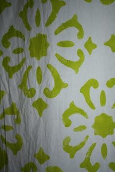 a white and green wallpaper with an animal print design on the back of it