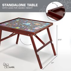 an image of a small table that is made out of wood and has different designs on it