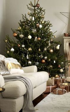 a living room with a christmas tree in the corner