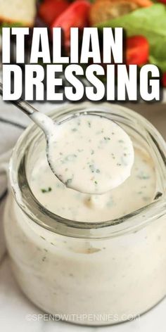 a spoon full of dressing with the words italian dressing on it and vegetables in the background