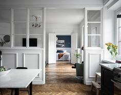 a room with white walls and wood floors