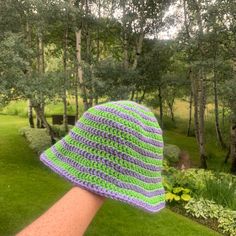 This is a handmade crochet bucket hat. It's use of bright colors allow you to spice up any outfit!  It is the perfect choice for any type of weather, rain or shine! It is made to be ordered and is therefore open to customization! Feel free to message me with any specific questions or requests. Can be made in different sizes: S, M, L, XL Rough Measurements for reference: circumference  S - 18" M - 19.5" L - 21" (shown in images) XL - 22.5" diameter  S - 6" M - 7" L - 8" XL - 9" **All items should Crochet Brimmed Bucket Hat For Outdoor, Green Yarn Bucket Hat With Curved Brim, Outdoor Crochet Brimmed Bucket Hat, Outdoor Crochet Bucket Hat, Outdoor Crochet Yarn Bucket Hat, Outdoor Yarn Crochet Bucket Hat, One Size Crochet Bucket Hat For Outdoor, Trendy Handmade Green Crochet Hat, Purple Crochet Yarn Bucket Hat