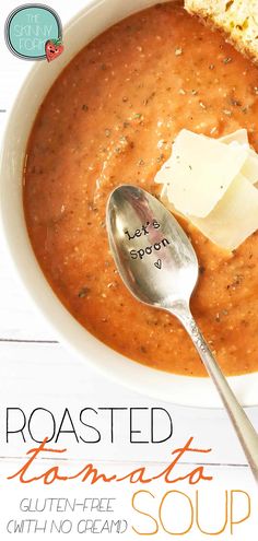 a bowl of roasted tomato soup with bread and parmesan cheese on the side