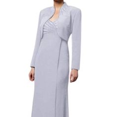 There Is No Better Way To Pair Sophisticated Style With Glamour Than With This Full Length Dress By Alexander By Daymor 3112! Showcases A Long Sleeve Blazer With Embellishments On The Collar And Spread Across The Bodice, The Dress Features A Modified Sweetheart Neckline And An Empire Waist. Finishing The Look Is A Floor Length Sheath Skirt. Be Ready To Charm Everyone In This Alexander By Daymor Dress. Model Is Wearing The Espresso Color. Model Is Wearing The Soft Blue Color. The Model Is Wearing Blue Chiffon Maxi Dress, Ralph Lauren Plaid Dress, Sage Dress, Sheath Skirt, Grey Maxi Dress, Red Dress Maxi, Maxi Dress Cocktail, Full Length Dress, Floral Print Maxi Dress