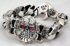 CRYSTAL RED EYE SKULL TRIBAL CUBAN STERLING SILVER BRACELET ~BRAND NEW 100% Solid sterling silver, polished. Features .925 Trademark on back of clasp. Sterling Silver Weight: 175 grams. Bracelet Width (Closed): 7/8” Inches (22.30 mm)   Large clear crystal oval cover ruby eye skull. Skilfully made and skull-fully made, Sterling Silver Skull Jewelry With Polished Finish, Custom Silver Handmade Bracelets, Collectible Silver Skull Jewelry, Handmade Custom Silver Bracelets, Silver Jewelry With Custom Hardware Gift, Silver Jewelry With Custom Hardware As Gift, Luxury Engraved Skull Jewelry, Luxury Adjustable Jewelry With Custom Hardware, Luxury Skull Jewelry For Gifts