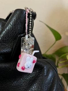 Enjoy a sip of sweetness with this hand sculpted Strawberry Milk Box Charm, the perfect accessory for your phone, keys, or handbag. I was inspired by Japanese and Korean milk and juice boxes. Charms can be used to accessorize your handbag, backpack, or phone.  Each charm is handmade and made to order with care and attention to detail. This hand sculpted item will be shipped 5-7 business days after your order is placed. Rectangular Keys Bag Charm For Gift, Cute Handmade Keychains For Gifts, Handmade Rectangular Bag Charm For Gift, White Rectangular Keychains For Gifts, White Rectangular Keychain For Gift, White Rectangular Keychain Gift, Novelty Pink Keychain For Gift, Cute Pink Rectangular Keychain, Cute Keychains With Lobster Clasp For Gifts