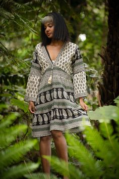 This stunning Tibetan Dress is a perfect addition to your boho and for and festival clothing lovers. This beautiful dress features a unique and geometric pattern that will make you stand out from the crowd.Made with cotton material, this tribal-inspired design dress features a flowing silhouette, playful tassels, and unique flare sleeves. Ideal for music festivals or beach parties, this dress will make you feel like a gypsy fairy princess. MEASUREMENTS: Arm length (seam to cuffs): 51 cm / 20.07 Tibetan Dress, Fringe Crop Top, Fall Pants, Crochet Fringe, Beach Parties, Flare Sleeves, Handwoven Fabric, Fairy Princess, Festival Clothing