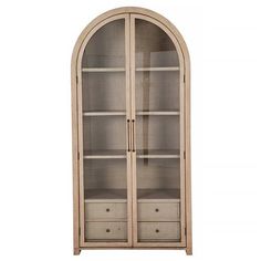 an arched glass display cabinet with drawers