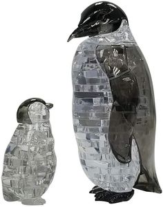 two plastic penguin figurines sitting next to each other on a white background, one is black and the other is clear