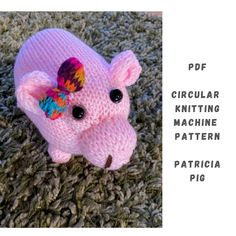 a pink knitted pig laying on top of a pile of green carpet next to the words, circular knitting machine pattern