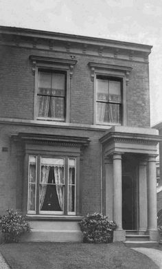 an old black and white photo of a house