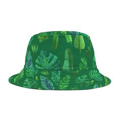 Experience Nature's Embrace - Our bucket hat, a canvas of lush greenery, captures the essence of the wild. Adorned with an exquisite collection of watercolor-style leaves, including the iconic monstera and delicate ferns, each leaf intricately detailed and cast in a spectrum of vibrant greens. Choose your hue - whether against a vivid background or a subtle tone, this hat offers a refreshing portrayal of natural beauty. Embrace the tropics, revel in the organic allure, and let the lush foliage accompany your style journey. First, it protected fishermen from rain in the 1900s. Now, the personalized bucket hat is making its way to the very top of fashion picks for all ages. Choose the seam lines, add your zaniest designs and patterns on the bucket hat and make a modern wardrobe staple come t Mens Sun Hats, Modern Wardrobe, Cute Hats, Sun Hats, Sew-in Labels, Wardrobe Staples, Bucket Hat, Caps Hats, Accessories Hats